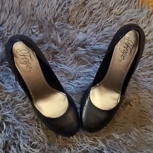 Women's high heel gently worn shoes.